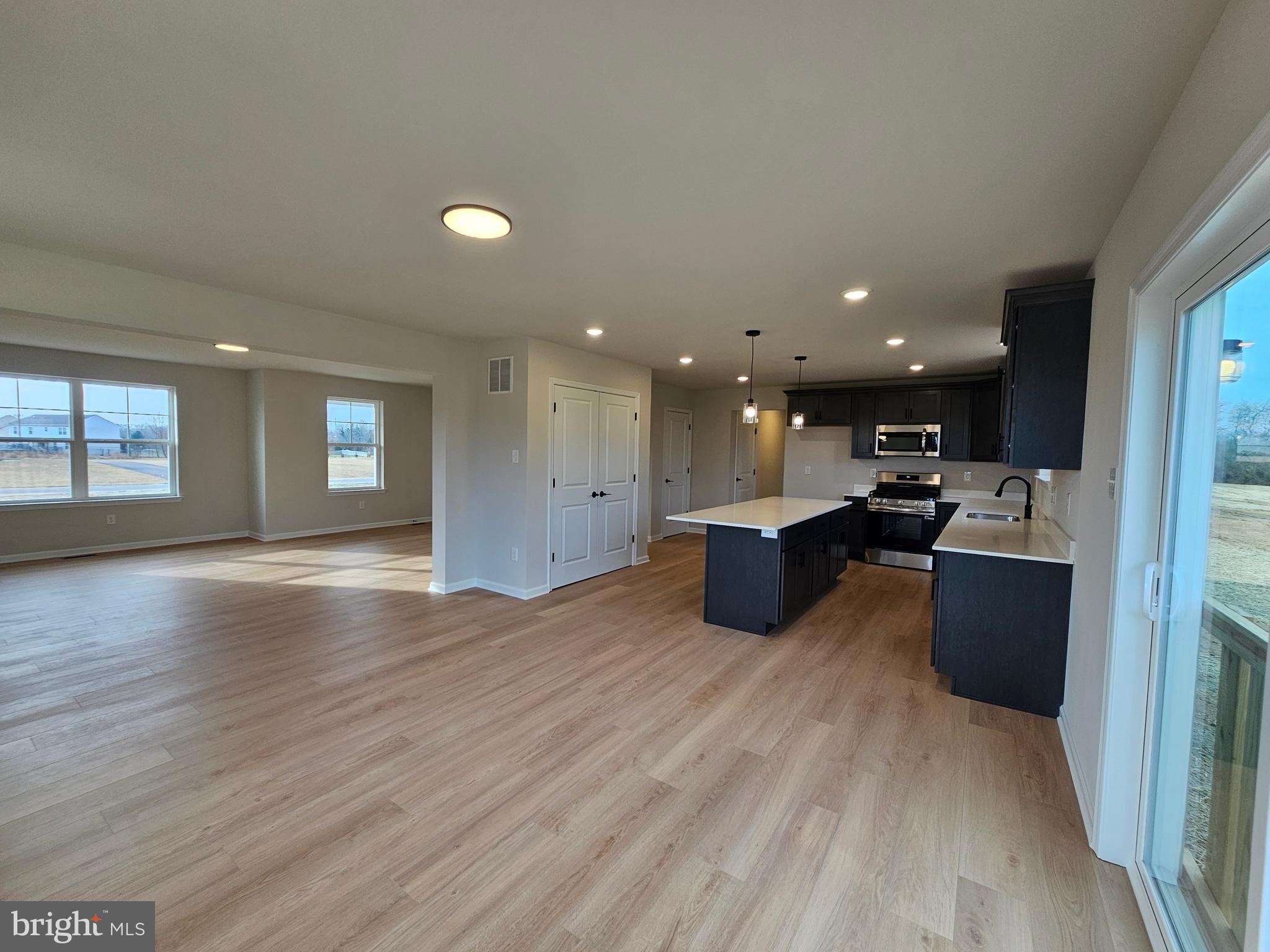 16 Field Stone Court Bridgeton, NJ 08302 - Photo 7 of 20 a view of kitchen with kitchen island microwave and wooden floor