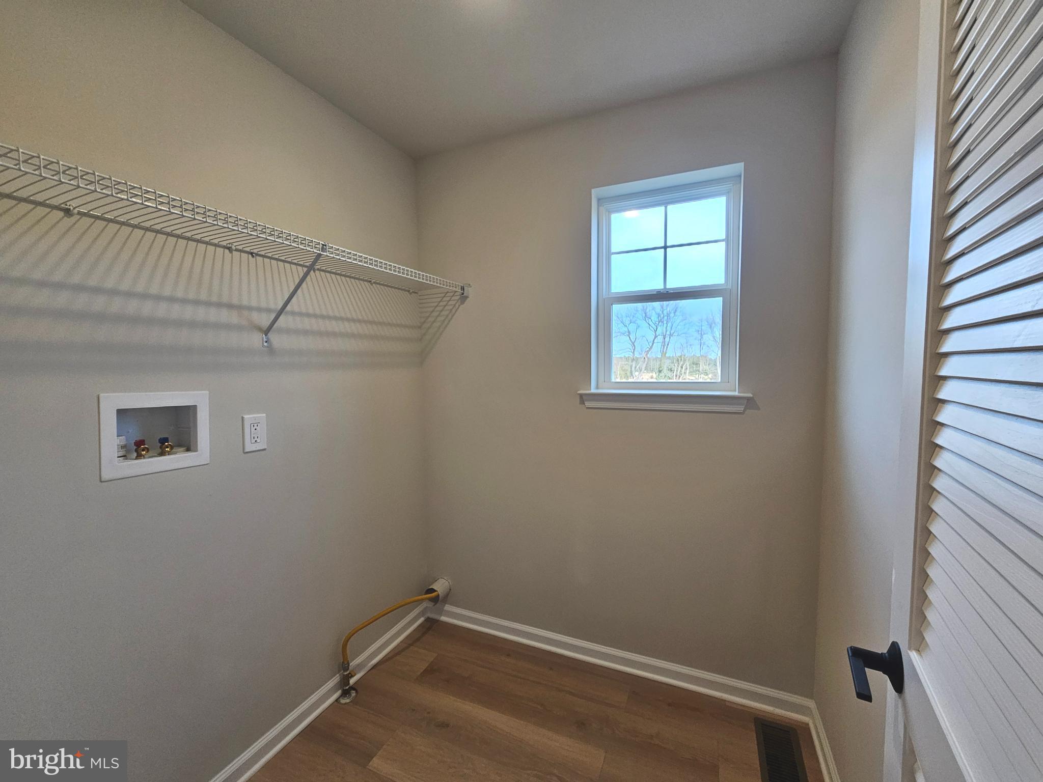 16 Field Stone Court Bridgeton, NJ 08302 - Photo 10 of 20 a view of a room with rack on the wall and a window