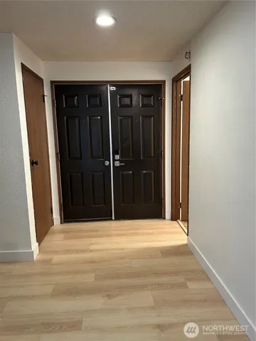 a view of an empty room with a window