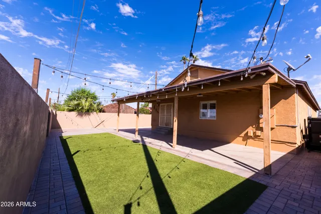 a view of a backyard of the house