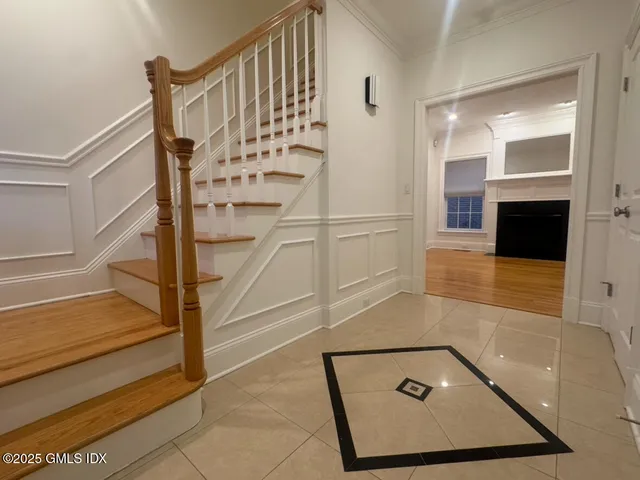 a view of a room with wooden floor and door