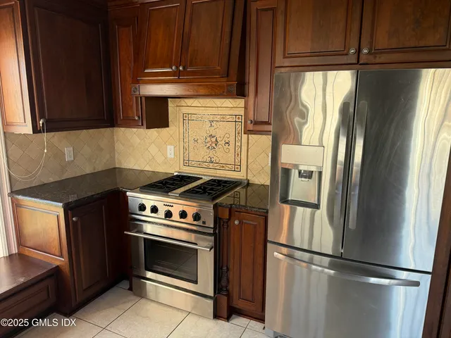 a view of a house with potted plants