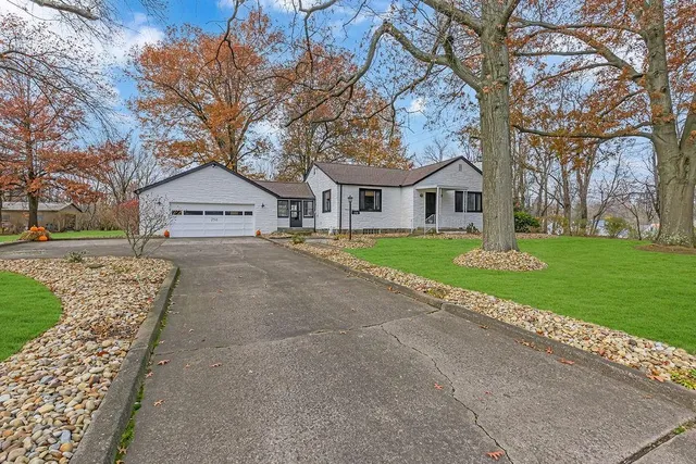 a front view of a house with garden