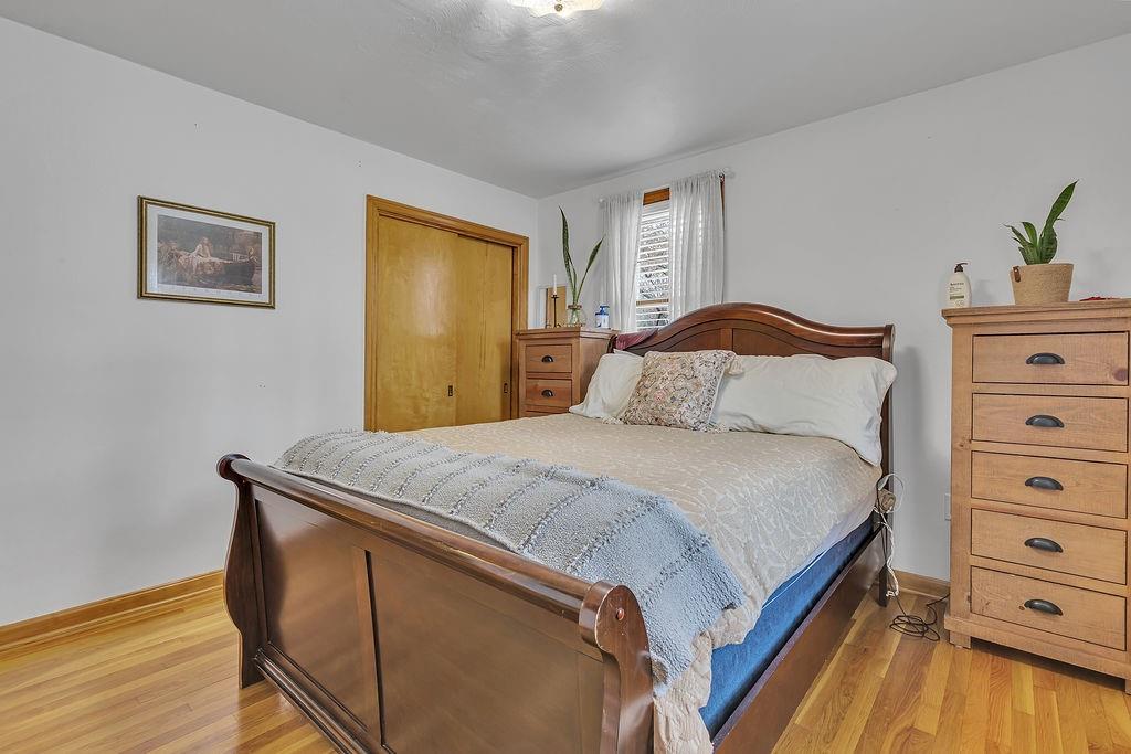 250 Neville Road Beaver, PA 15009 - Photo 19 of 36 a bedroom with a bed and a dresser