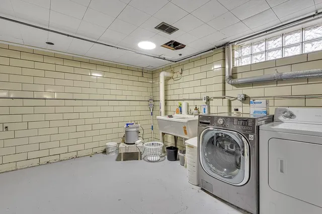 a view of a storage & utility room with washer and dryer