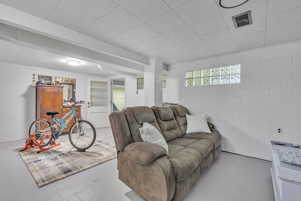 250 Neville Road Beaver, PA 15009 - Photo 28 of 36 a living room with furniture a gym equipment and wooden floor