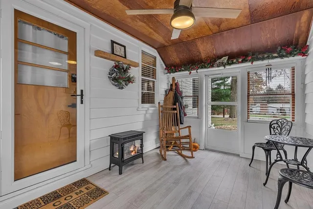 a view of a livingroom with furniture and a window