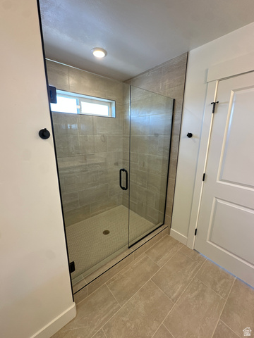 1225 West 500 South Logan, UT 84321 - Photo 36 of 39 Spacious walk-in shower featuring a frameless glass enclosure with matte black hardware