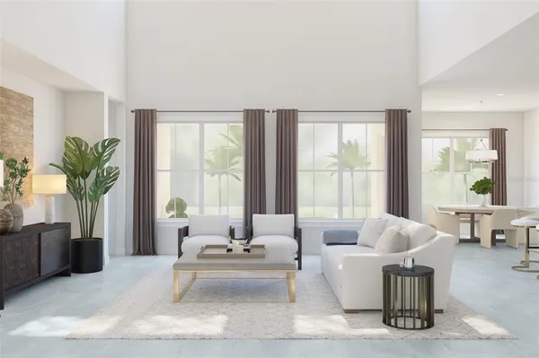 a living room with furniture and large windows