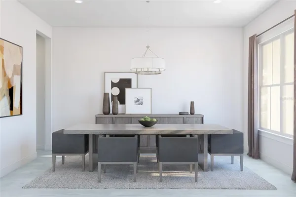 a dining room with furniture and window