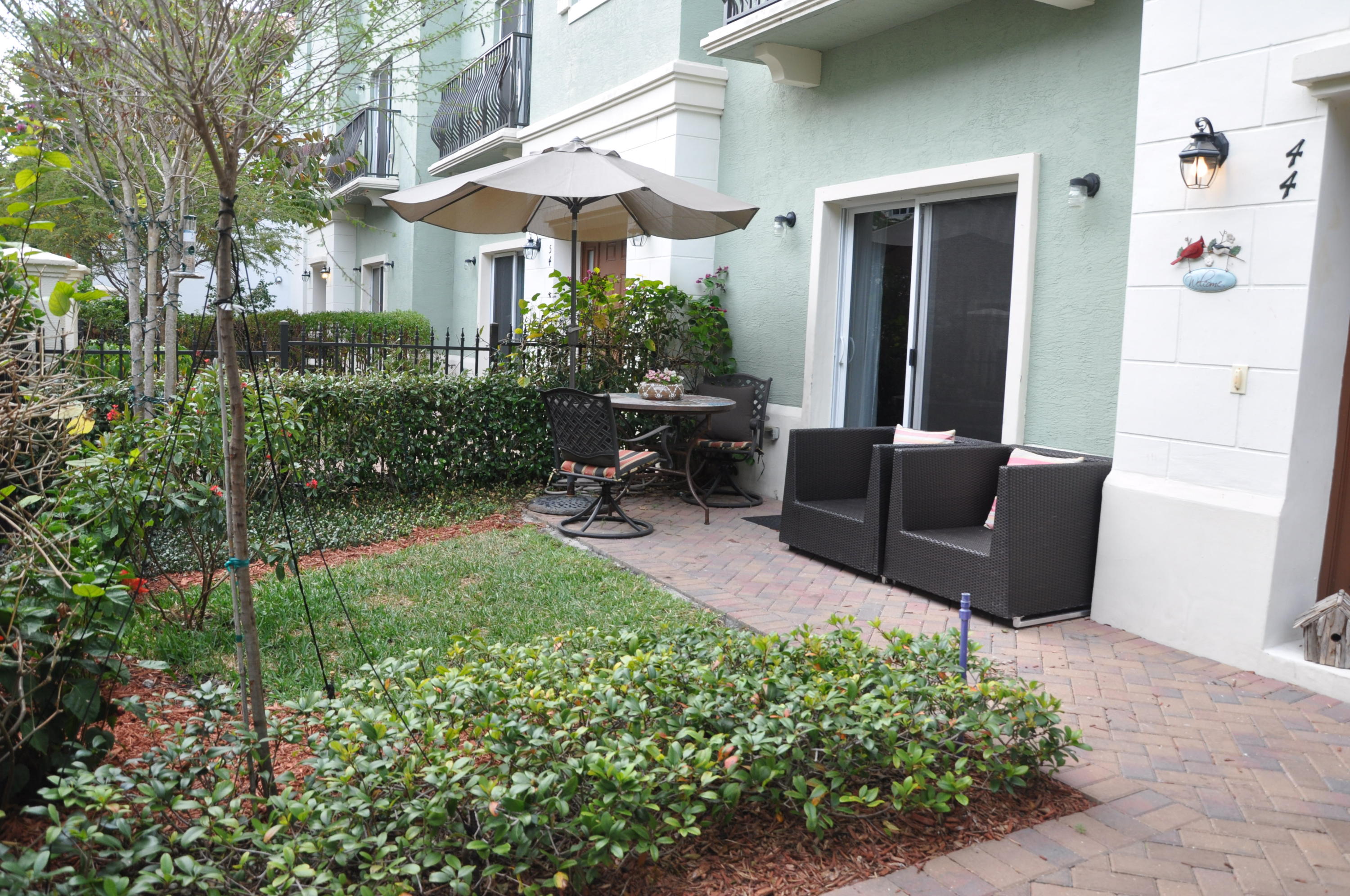 44 Northwest 7th Street Boca Raton, FL 33432 - Photo 3 of 24 Private Fenced PatioLandscaped Yard