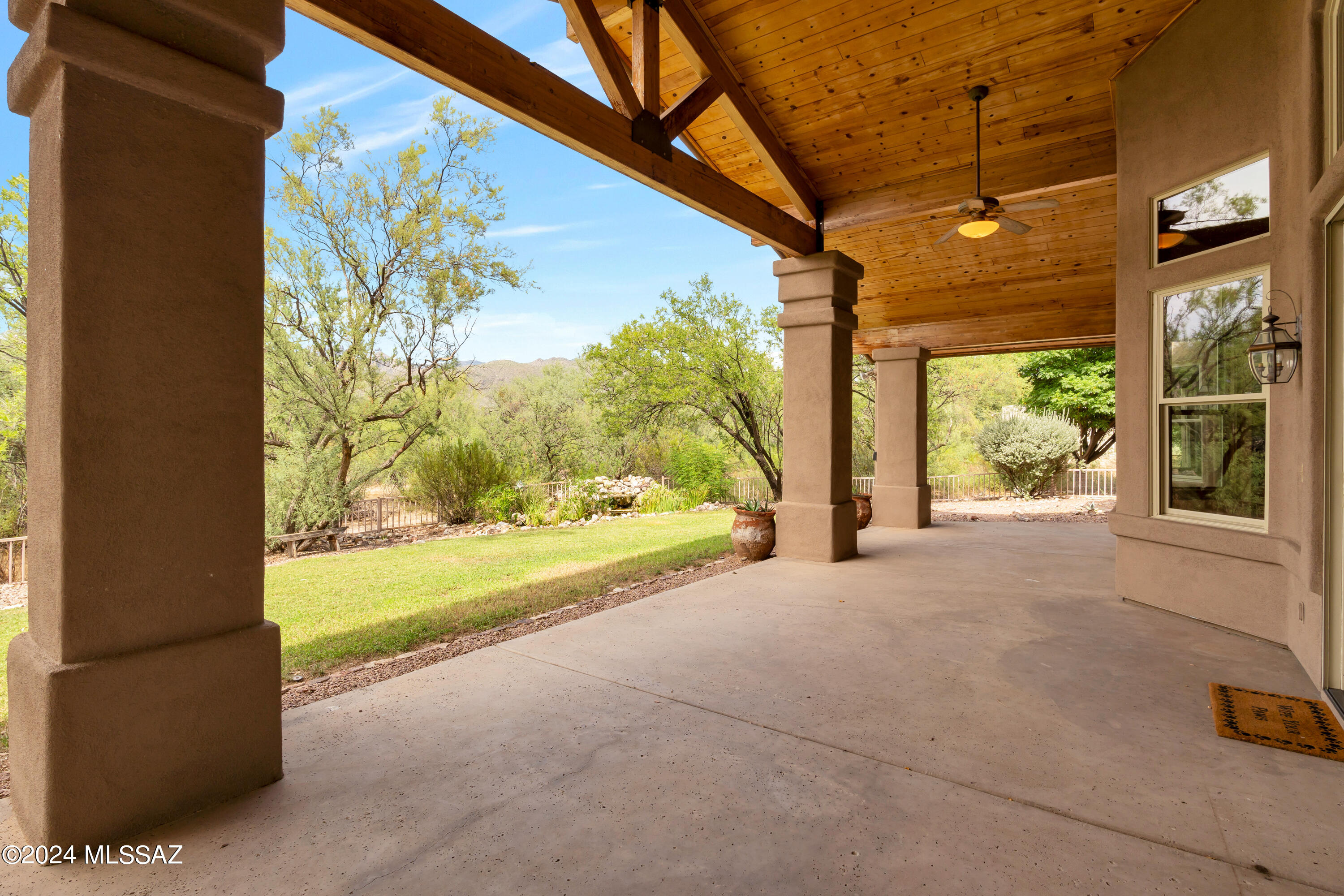 4001 North Harrison Road Tucson, AZ 85749 - Photo 41 of 50 a view of a room with wooden floor and a porch