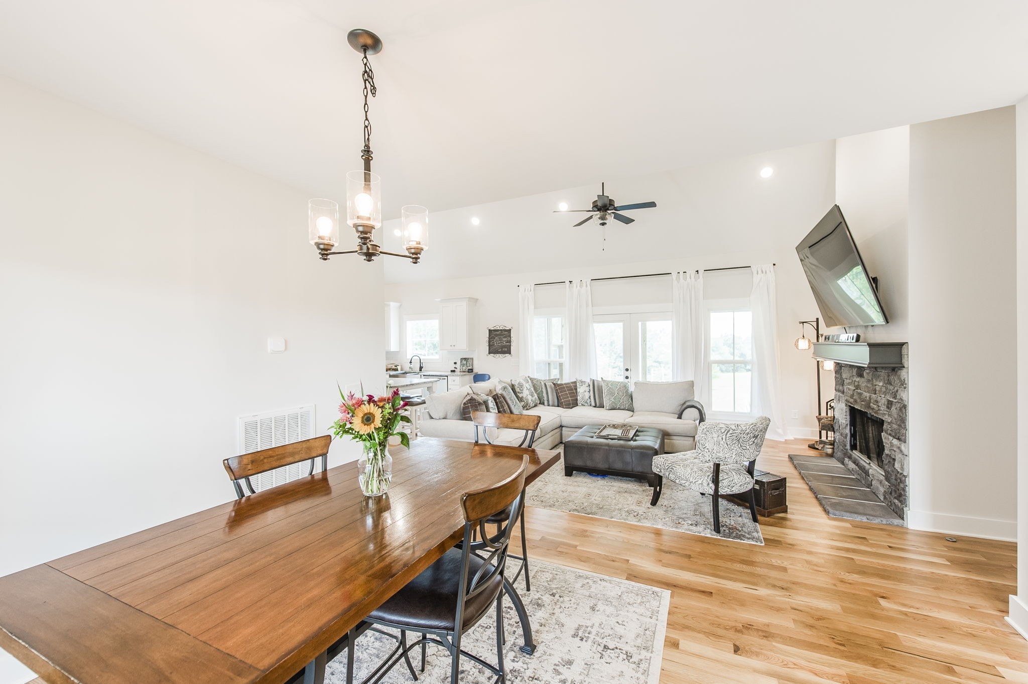 3186 Battle Creek Road Springfield, TN 37172 - Photo 11 of 59 a view of a dining room and livingroom with furniture wooden floor a chandelier