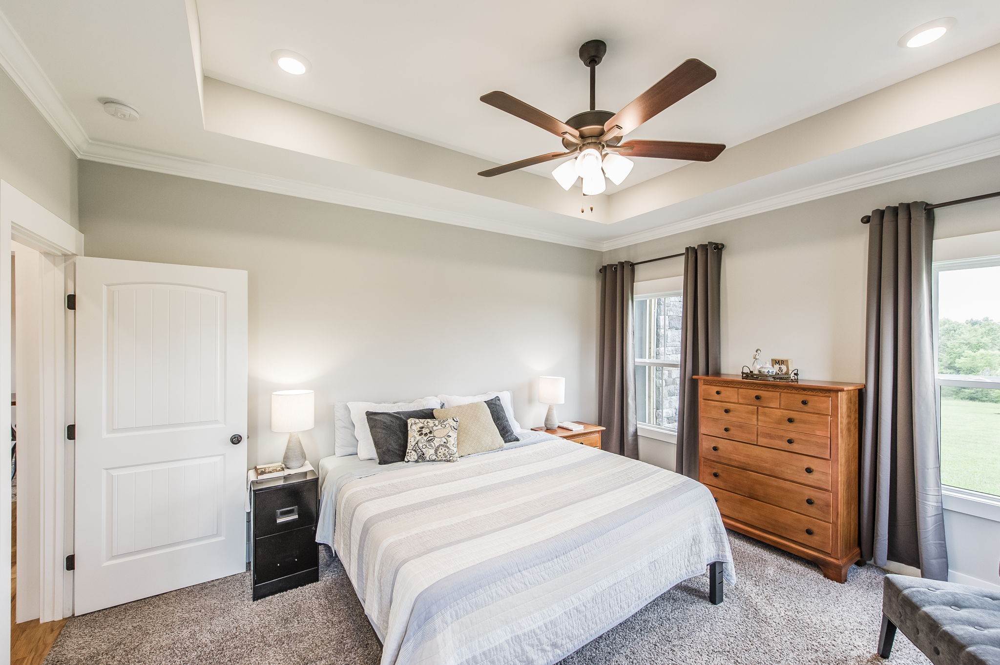 3186 Battle Creek Road Springfield, TN 37172 - Photo 27 of 59 a bedroom with a bed and a chandelier