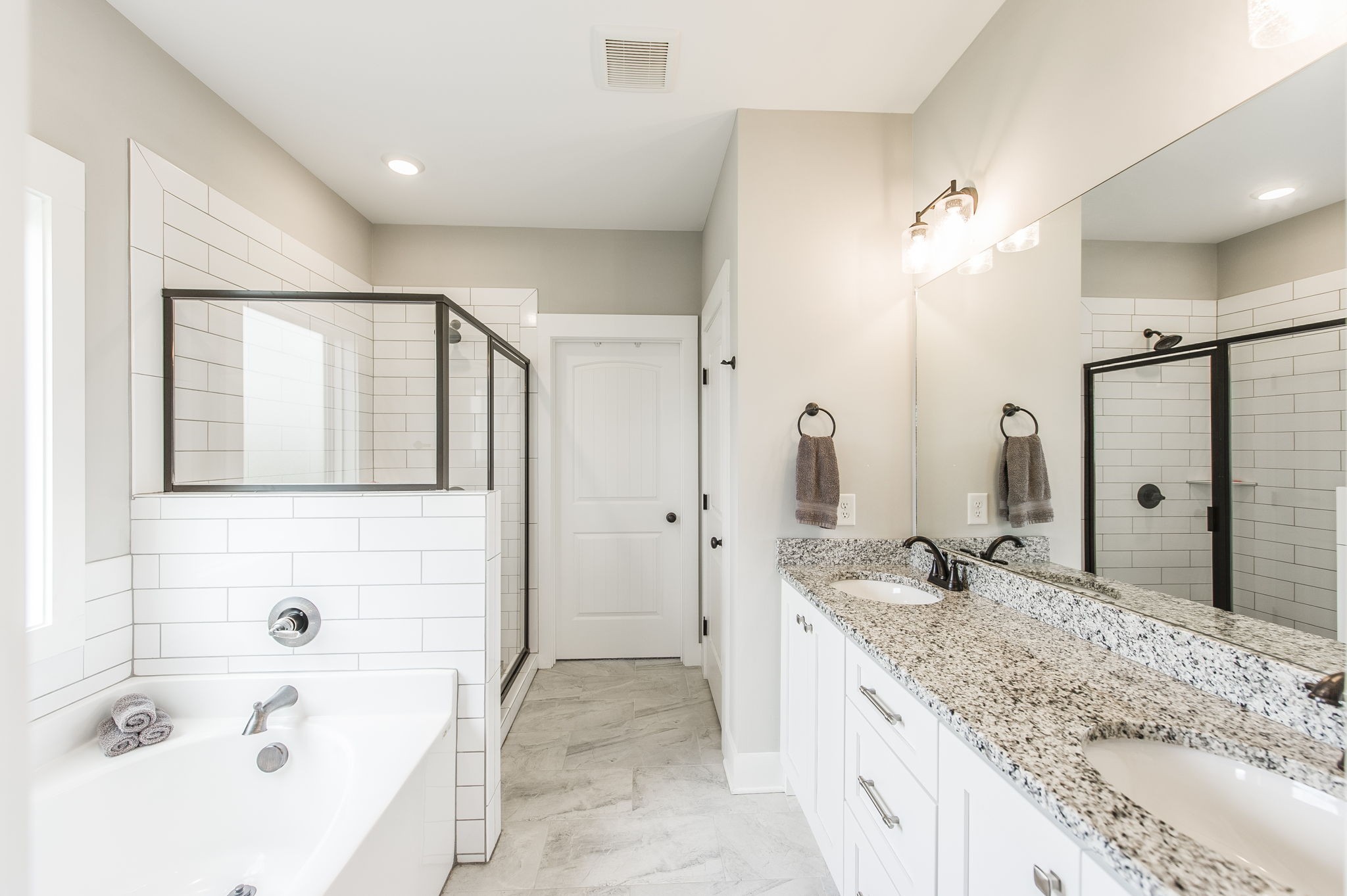 3186 Battle Creek Road Springfield, TN 37172 - Photo 28 of 59 a bathroom with a granite countertop tub sink and mirror
