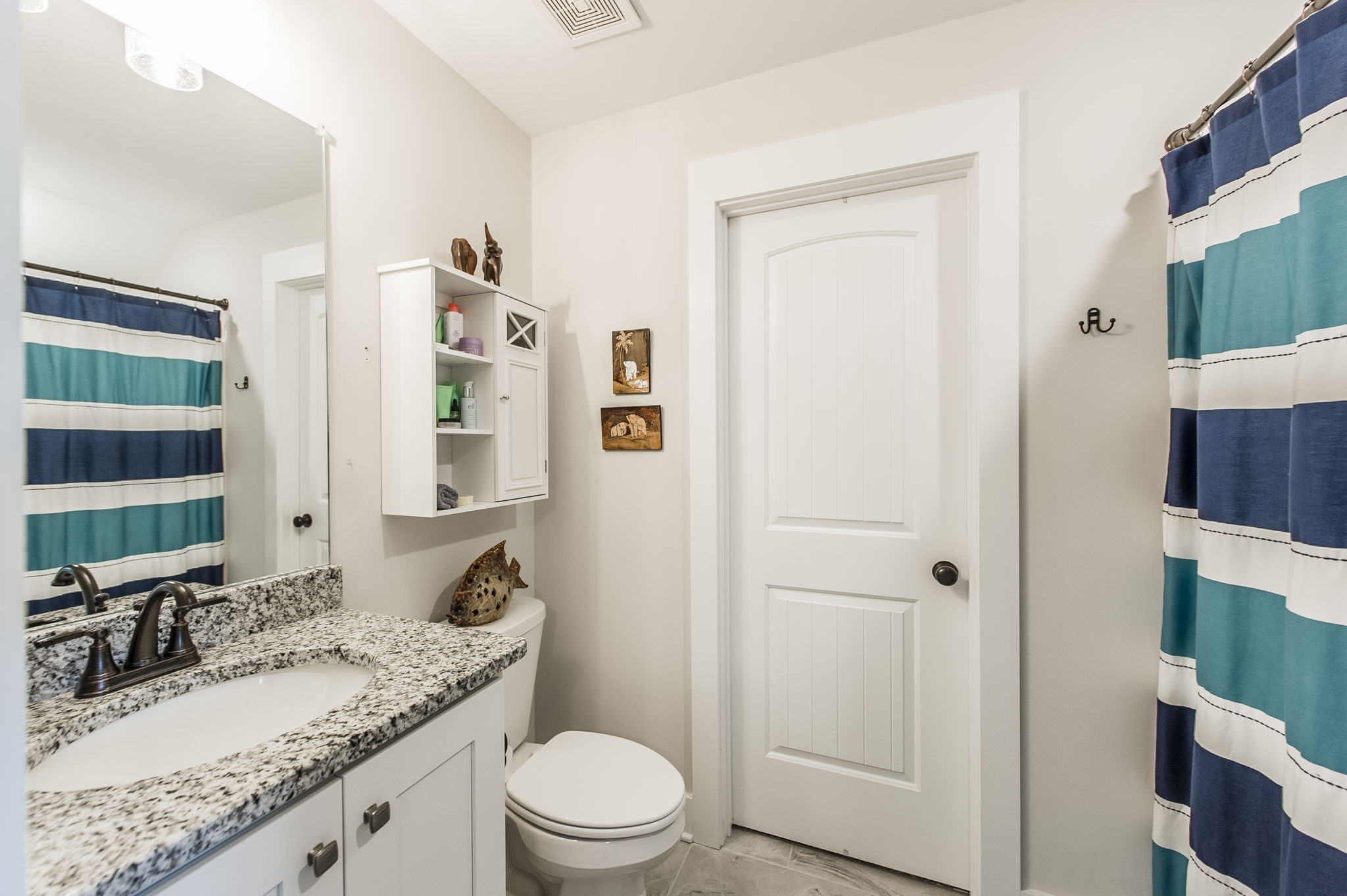 3186 Battle Creek Road Springfield, TN 37172 - Photo 33 of 59 a bathroom with a granite countertop sink toilet and shower