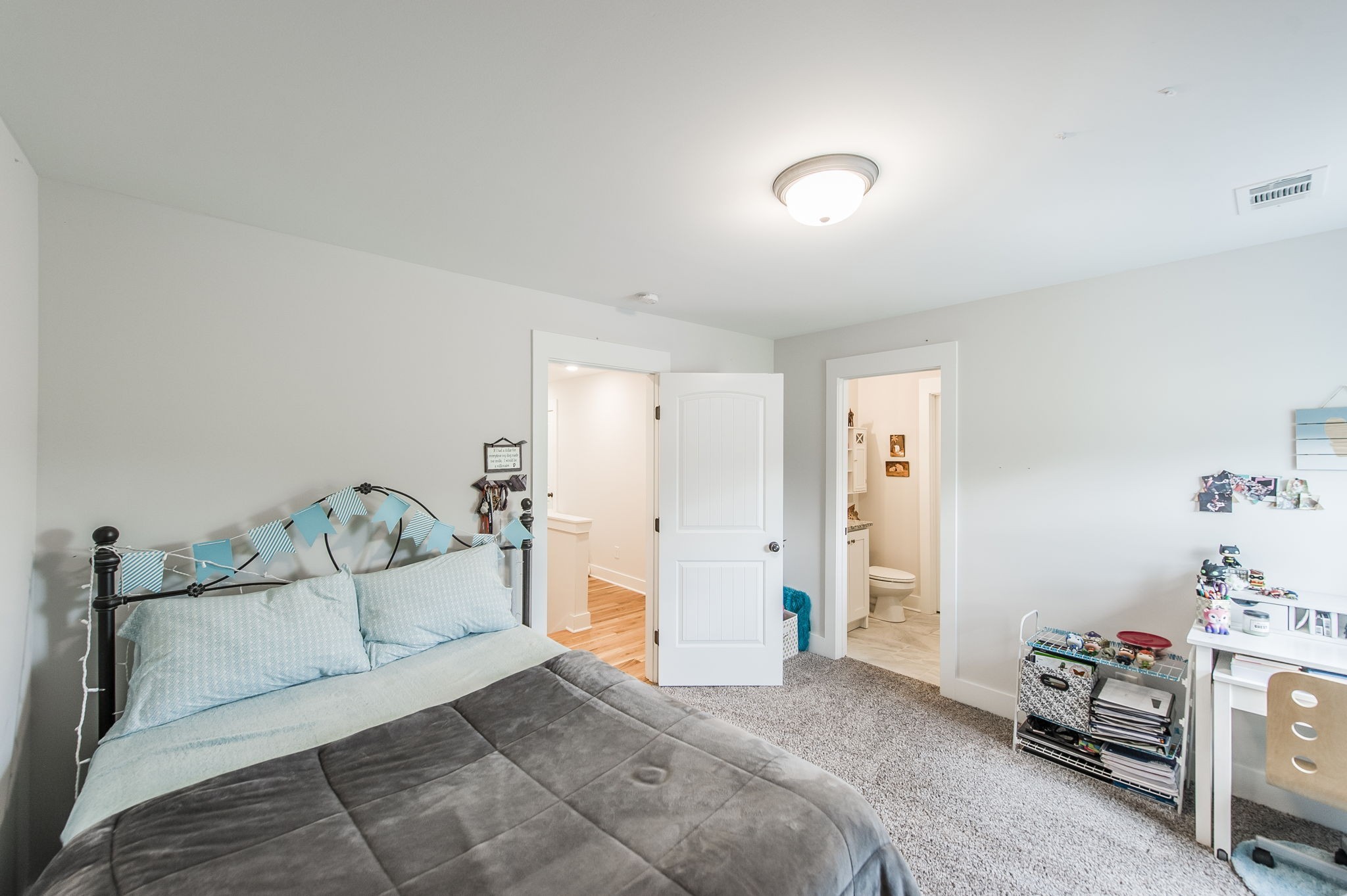 3186 Battle Creek Road Springfield, TN 37172 - Photo 37 of 59 a spacious bedroom with a bed and a couch