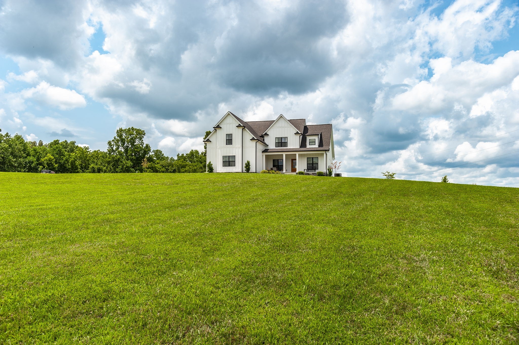3186 Battle Creek Road Springfield, TN 37172 - Photo 49 of 59 a view of a house with a big yard and large trees