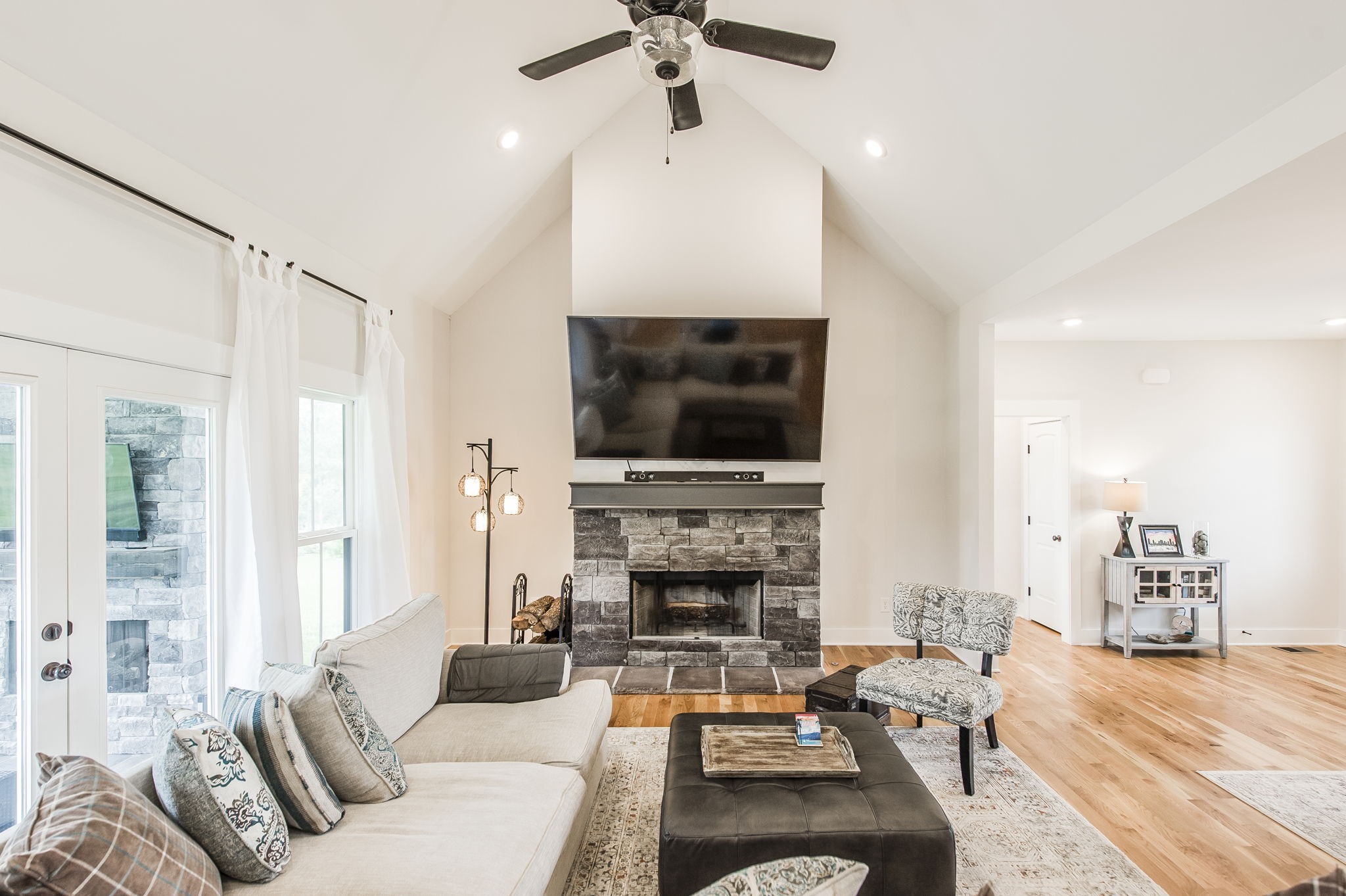 3186 Battle Creek Road Springfield, TN 37172 - Photo 10 of 59 a living room with furniture a flat screen tv and a fireplace