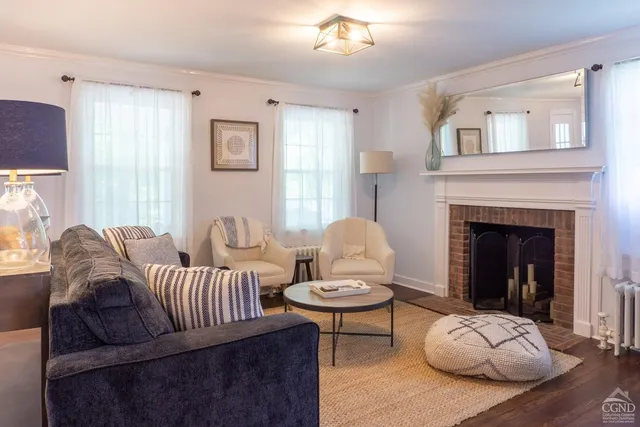 a living room with furniture and a fireplace