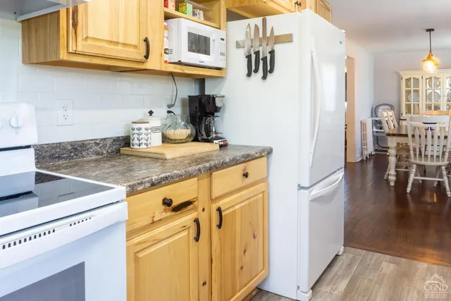 a kitchen with stainless steel appliances granite countertop a sink and cabinets