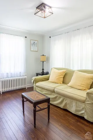 a bedroom with furniture and a window