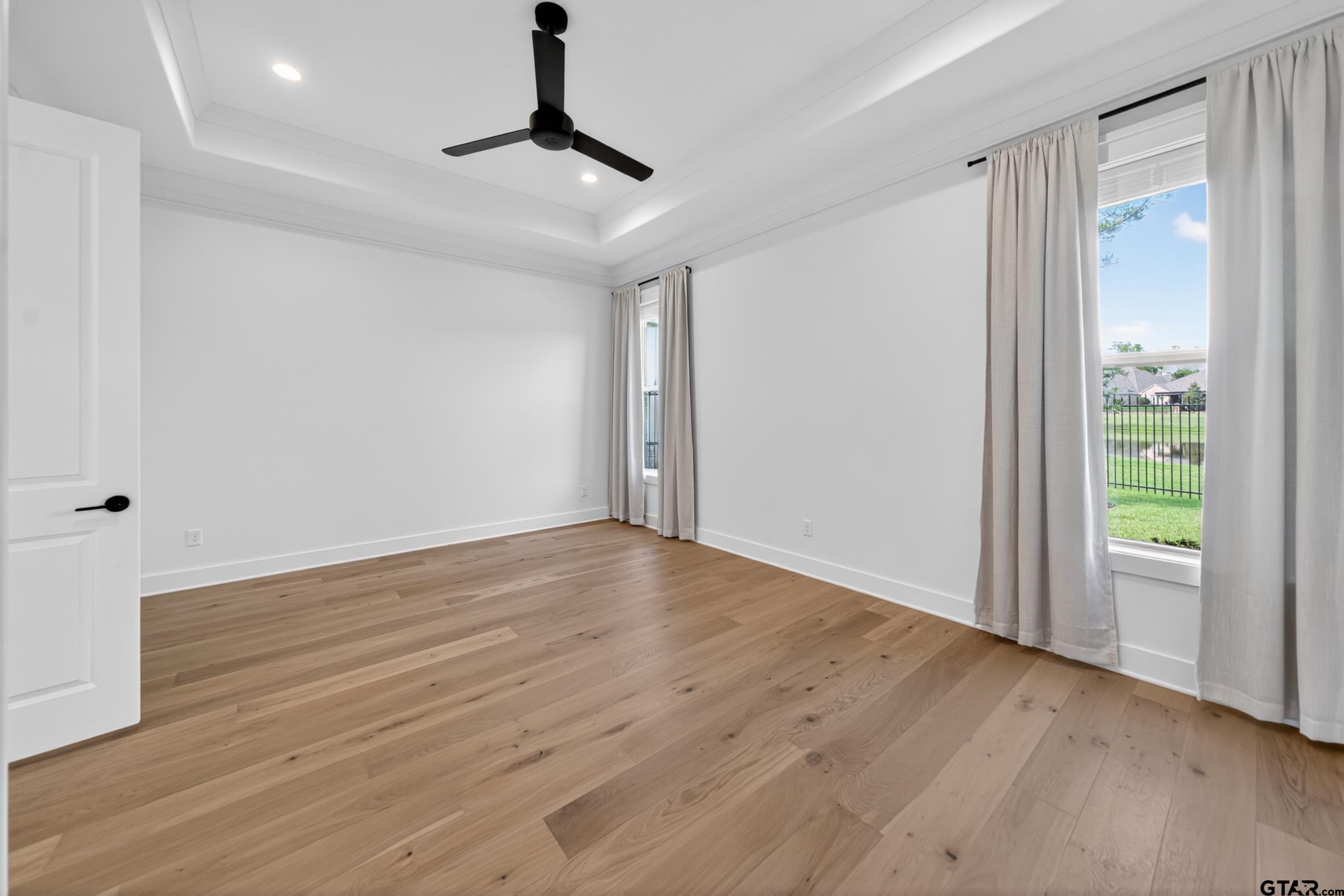 7517 Cross Gate Way Tyler, TX 75703 - Photo 15 of 47 a view of empty room with wooden floor and fan