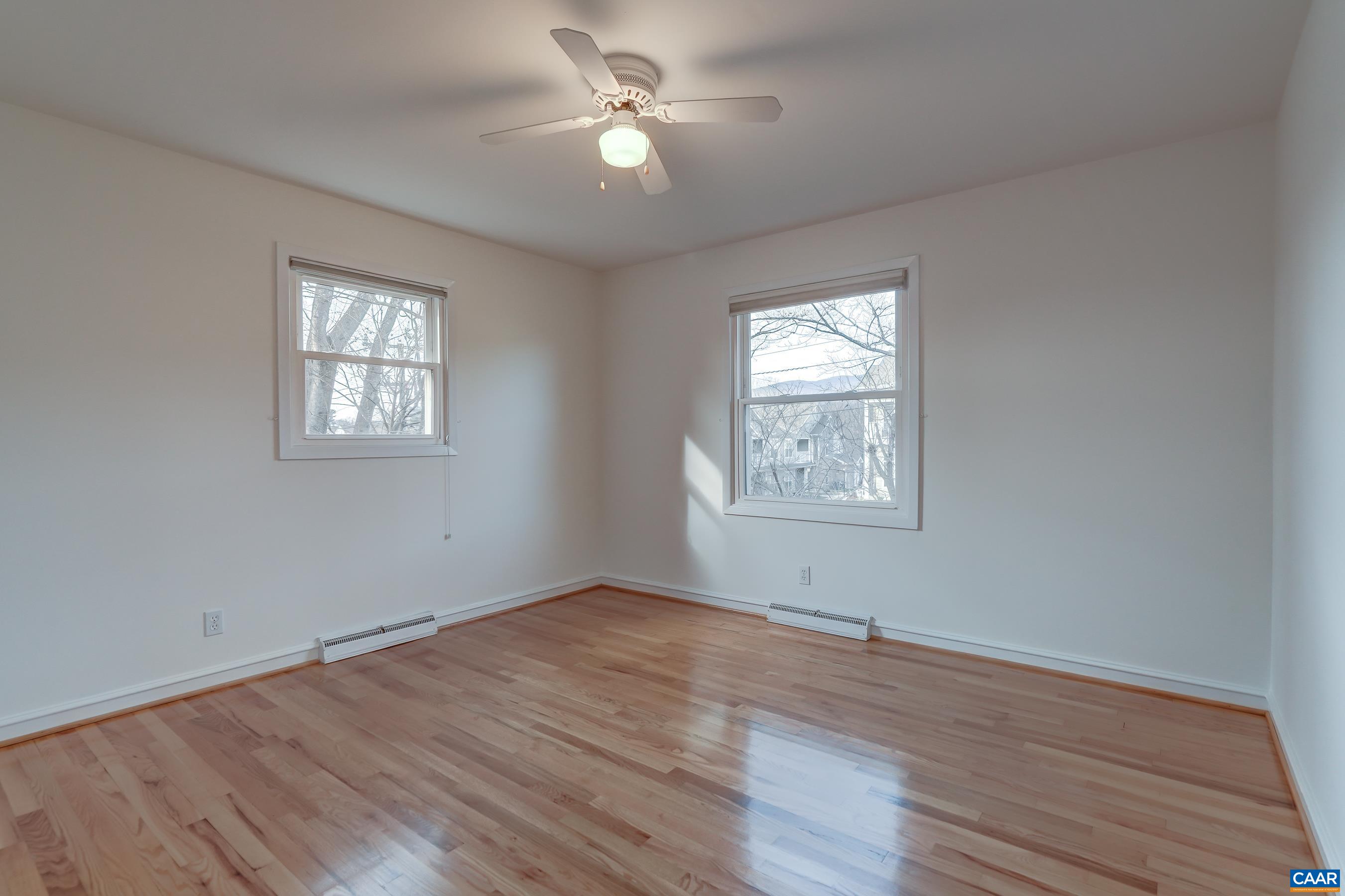 1179 Blue Ridge Avenue Crozet, VA 22932 - Photo 23 of 43 a view of empty room with wooden floor and fan