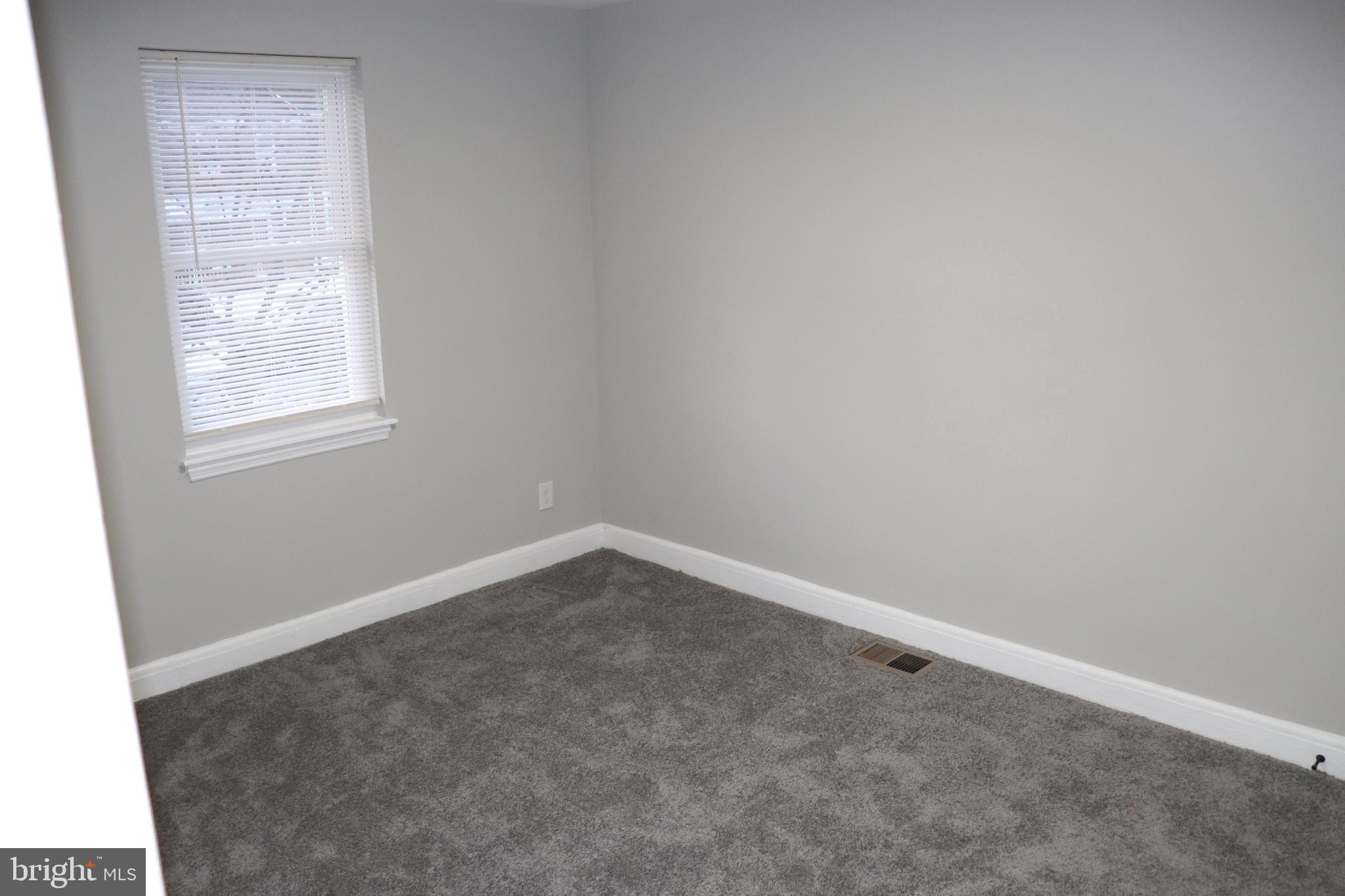 8623 Willow Oak Road Parkville, MD 21234 - Photo 16 of 27 an empty room with a window
