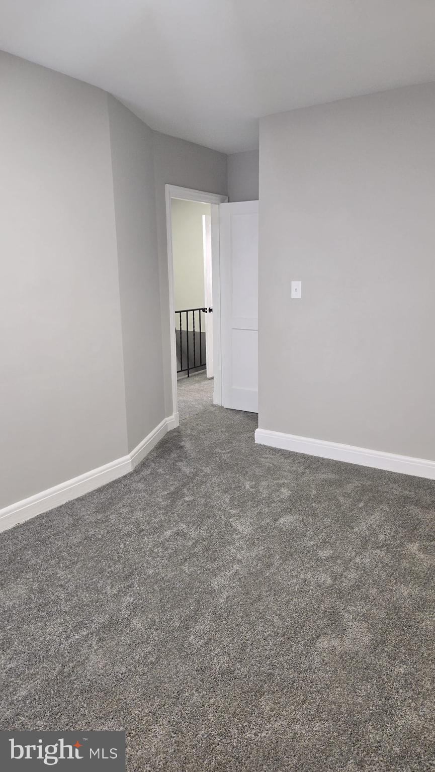 8623 Willow Oak Road Parkville, MD 21234 - Photo 20 of 27 a view of an empty room and window