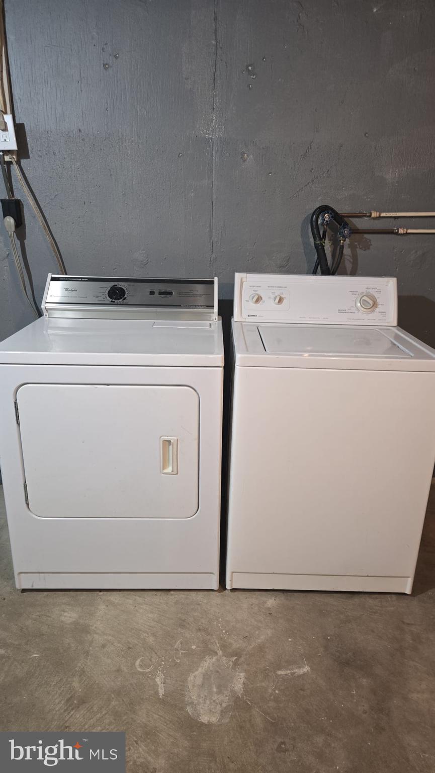 8623 Willow Oak Road Parkville, MD 21234 - Photo 26 of 27 a utility room with dryer and washer