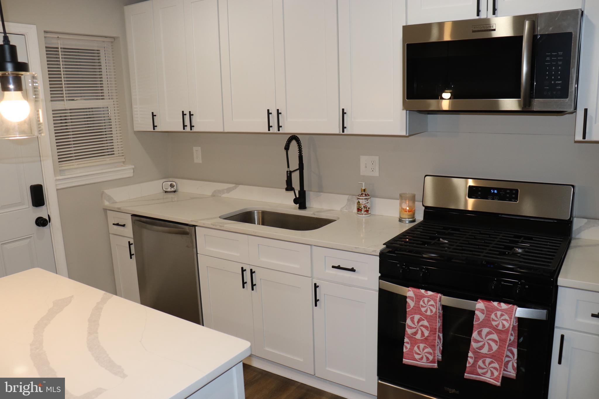 8623 Willow Oak Road Parkville, MD 21234 - Photo 5 of 27 a kitchen with a sink and a stove
