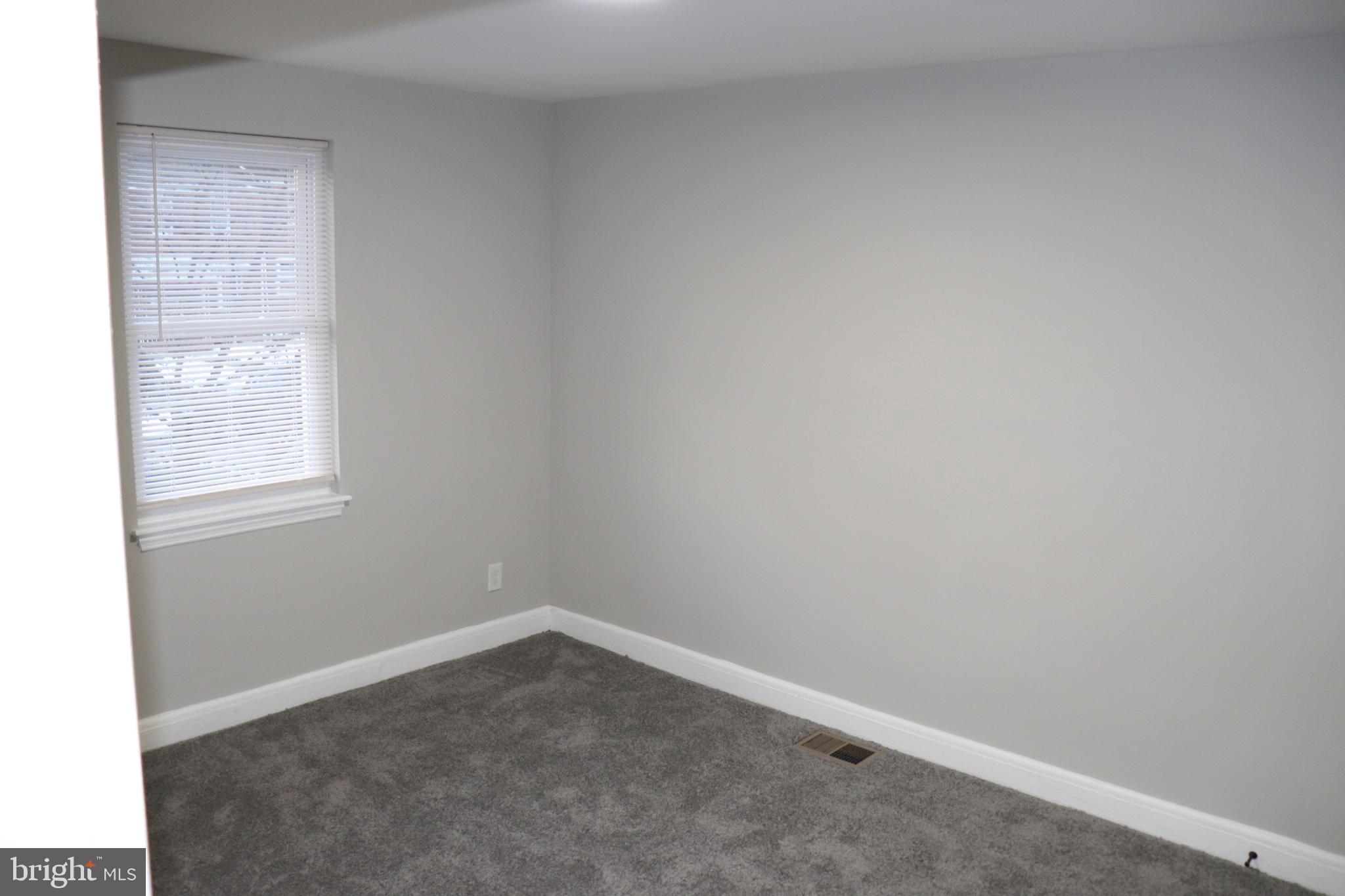 8623 Willow Oak Road Parkville, MD 21234 - Photo 7 of 27 an empty room with a window