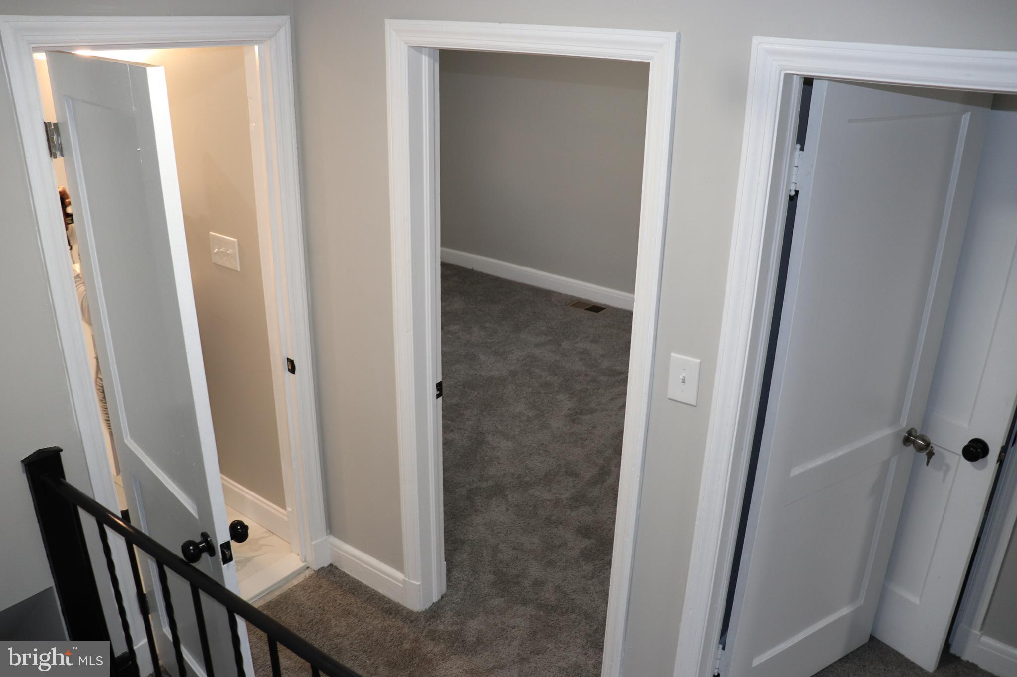 8623 Willow Oak Road Parkville, MD 21234 - Photo 9 of 27 a view of a bathroom from a corridor