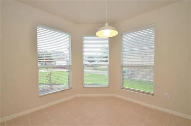 a view of a room that has a window in it