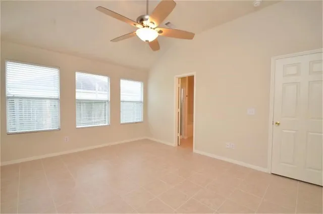 a view of an empty room with a window