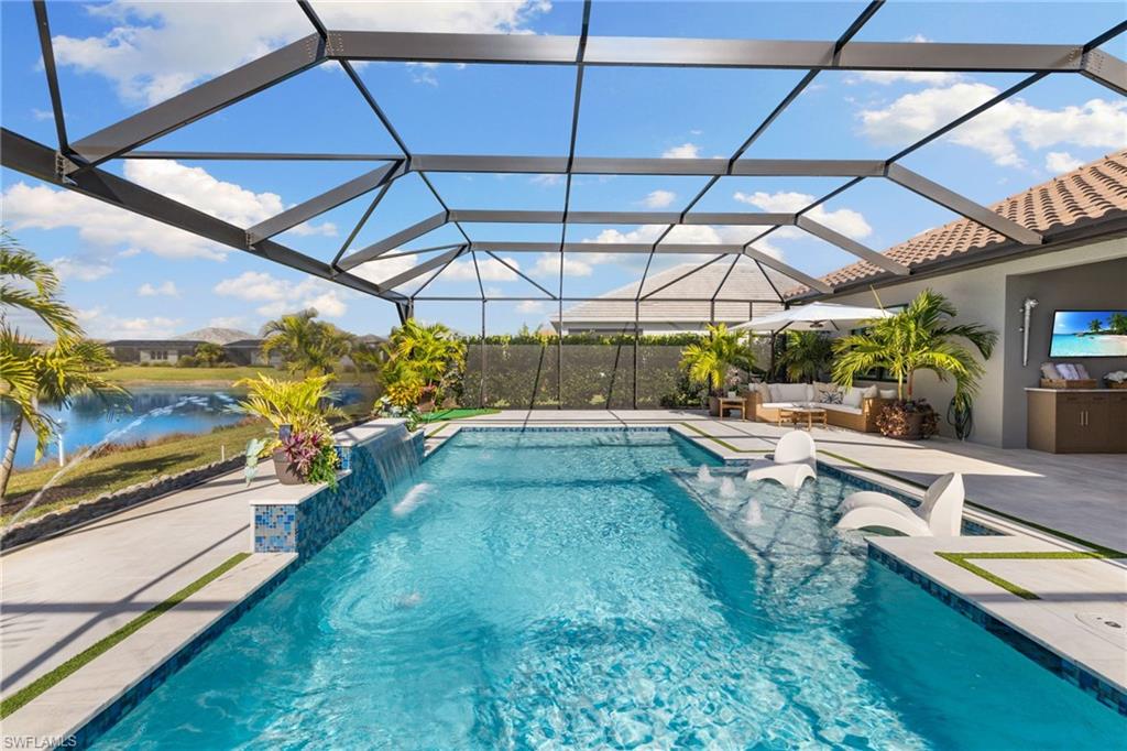 3967 Pegasus Way Naples, FL 34120 - Photo 29 of 50 a view of a backyard with a small swimming pool