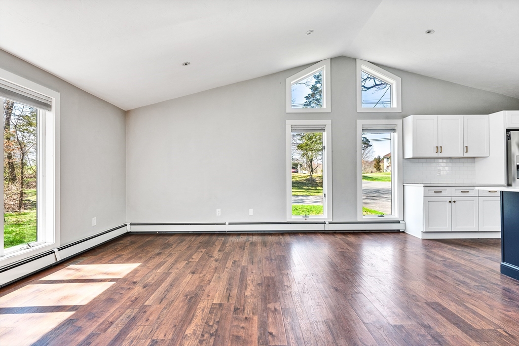 151 Wheeler Street Rehoboth, MA 02769 - Photo 14 of 36 a view of an empty room with a window and wooden floor
