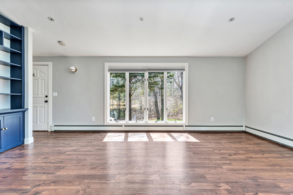 151 Wheeler Street Rehoboth, MA 02769 - Photo 16 of 36 a view of an empty room with wooden floor and a window