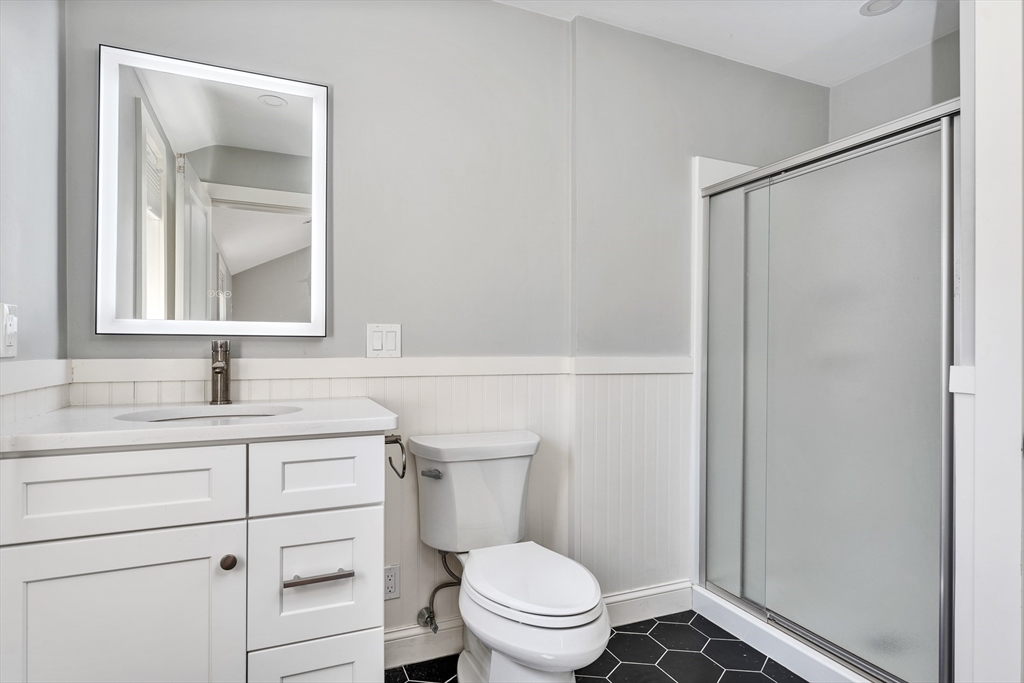 151 Wheeler Street Rehoboth, MA 02769 - Photo 17 of 36 a bathroom with a sink a toilet and vanity