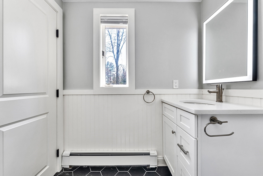 151 Wheeler Street Rehoboth, MA 02769 - Photo 18 of 36 a bathroom with a sink and a mirror