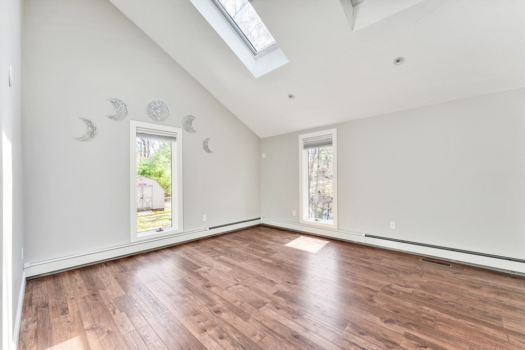 151 Wheeler Street Rehoboth, MA 02769 - Photo 19 of 36 an empty room with wooden floor and windows
