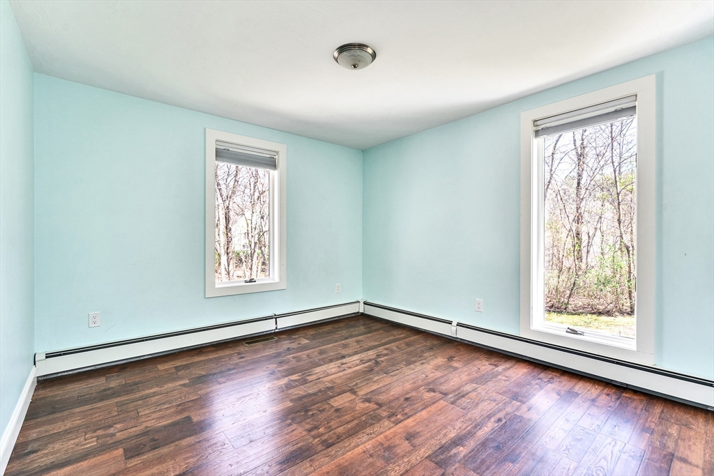 151 Wheeler Street Rehoboth, MA 02769 - Photo 21 of 36 an empty room with wooden floor and windows