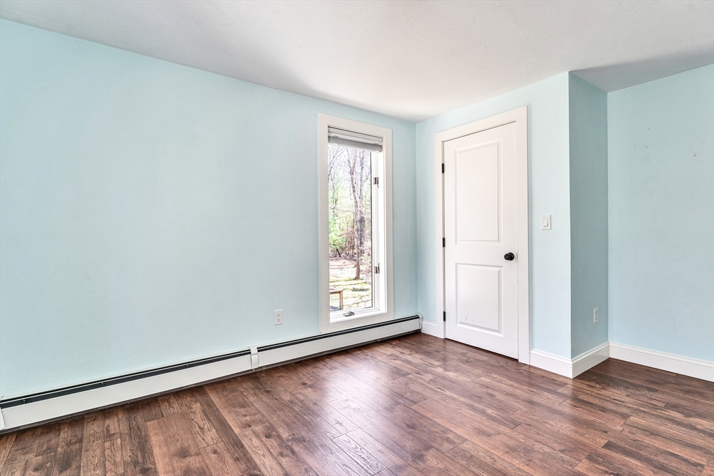 151 Wheeler Street Rehoboth, MA 02769 - Photo 23 of 36 an empty room with wooden floor and windows