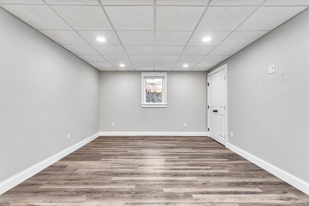 151 Wheeler Street Rehoboth, MA 02769 - Photo 26 of 36 a view of an empty room with wooden floor and a window