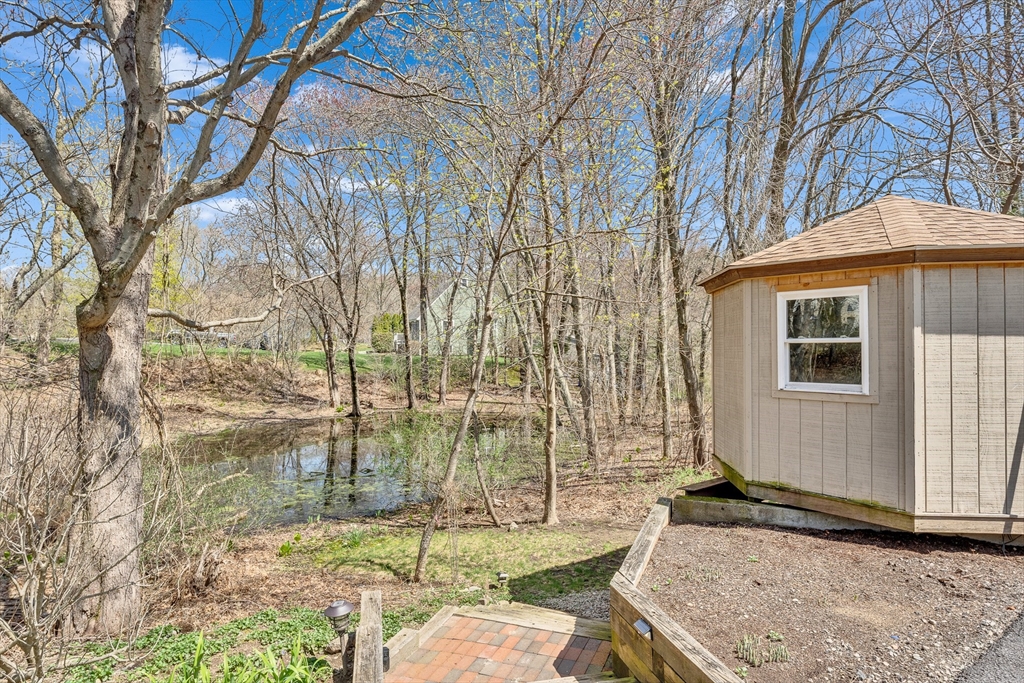 151 Wheeler Street Rehoboth, MA 02769 - Photo 3 of 36 a backyard of a house with yard and outdoor seating