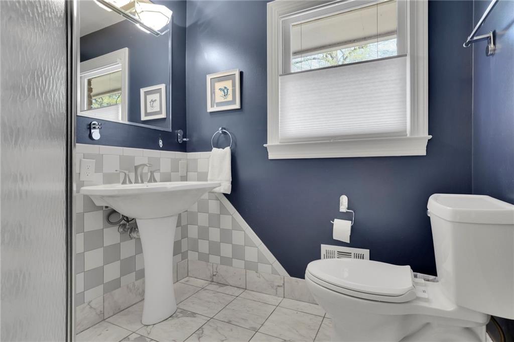 2476 Burnt Leaf Lane Decatur, GA 30033 - Photo 21 of 41 a bathroom with a toilet sink and mirror