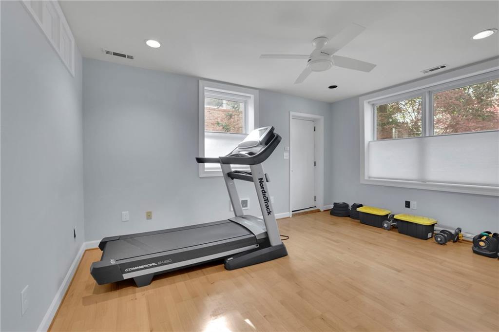 2476 Burnt Leaf Lane Decatur, GA 30033 - Photo 22 of 41 a room with gym equipment and a large window