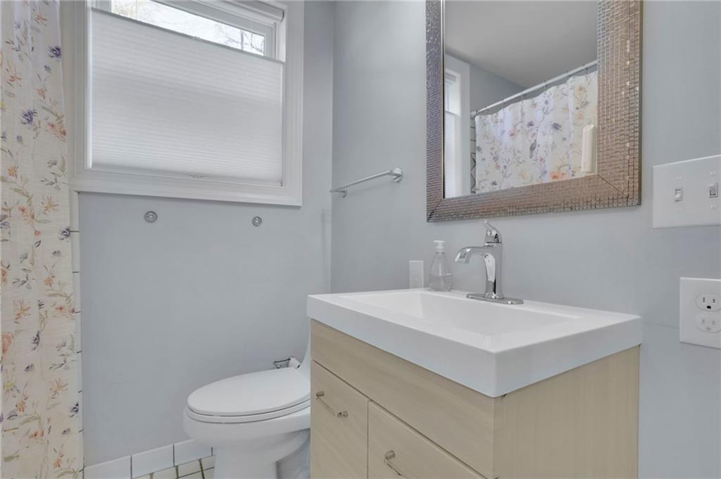 2476 Burnt Leaf Lane Decatur, GA 30033 - Photo 24 of 41 a bathroom with a sink mirror and toilet