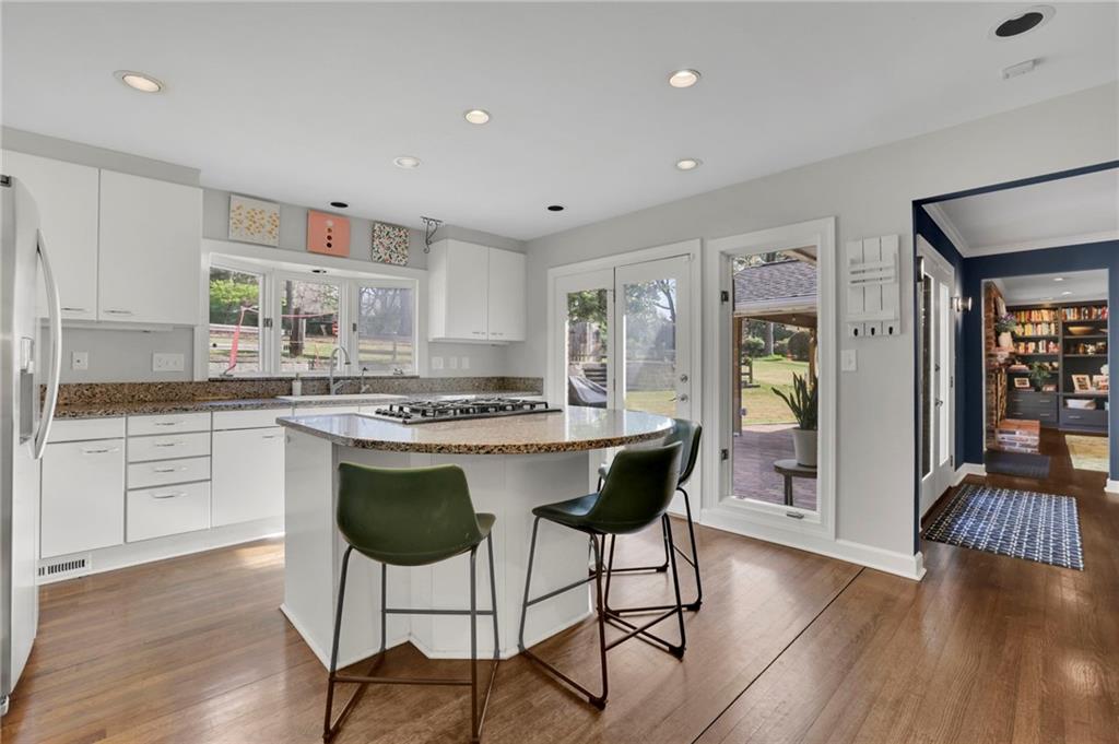 2476 Burnt Leaf Lane Decatur, GA 30033 - Photo 4 of 41 a kitchen with a table chairs sink and cabinets